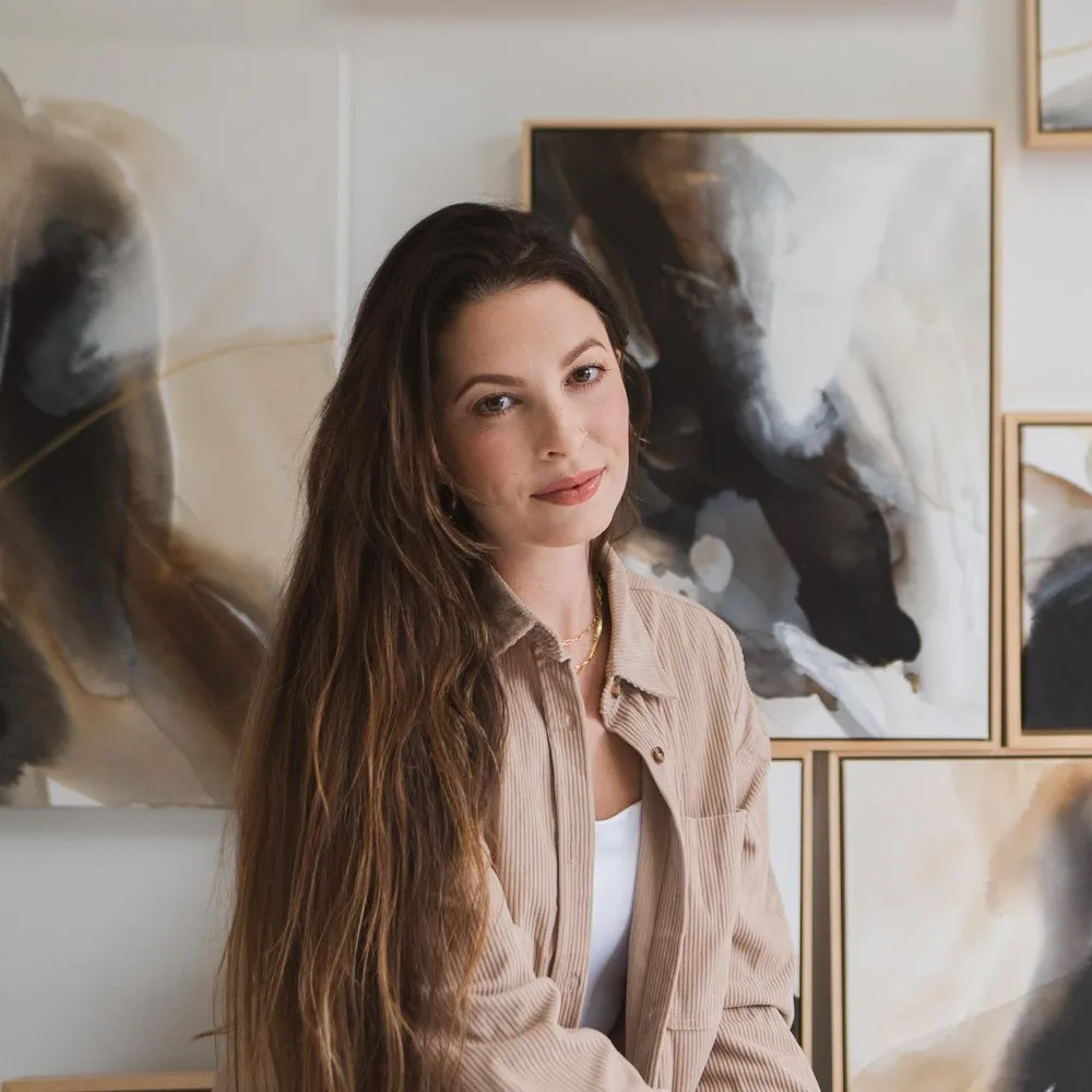 Rachel Reinert in front of her A Change Within paintings